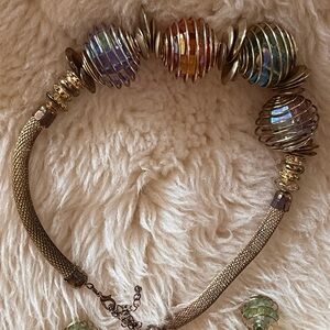 Elegant Multicolor Beaded Necklace
And green earrings